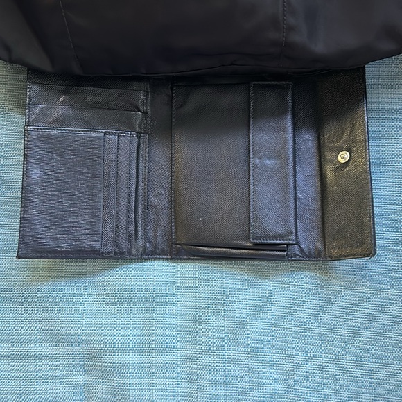 This is a black Prada crossbody with matching wallet. - Picture 6 of 8